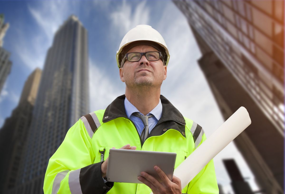 Construction engineer wearing safety vest